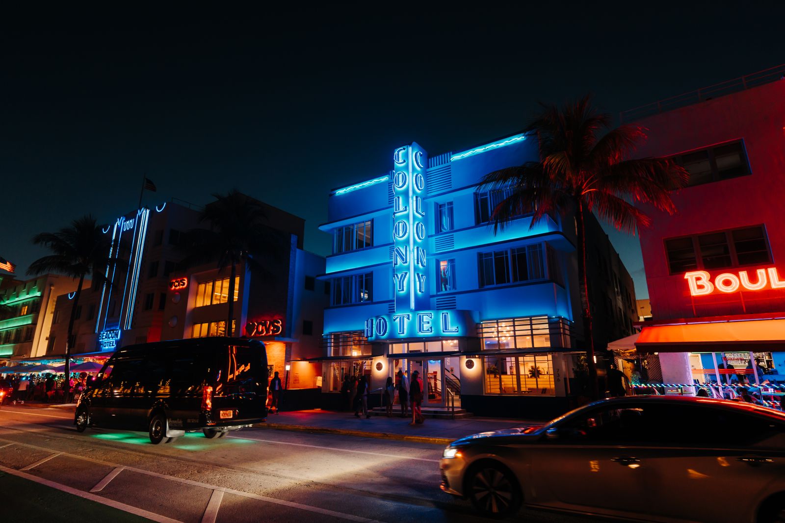 Neon-lit Art Deco hotel on Ocean Drive at night